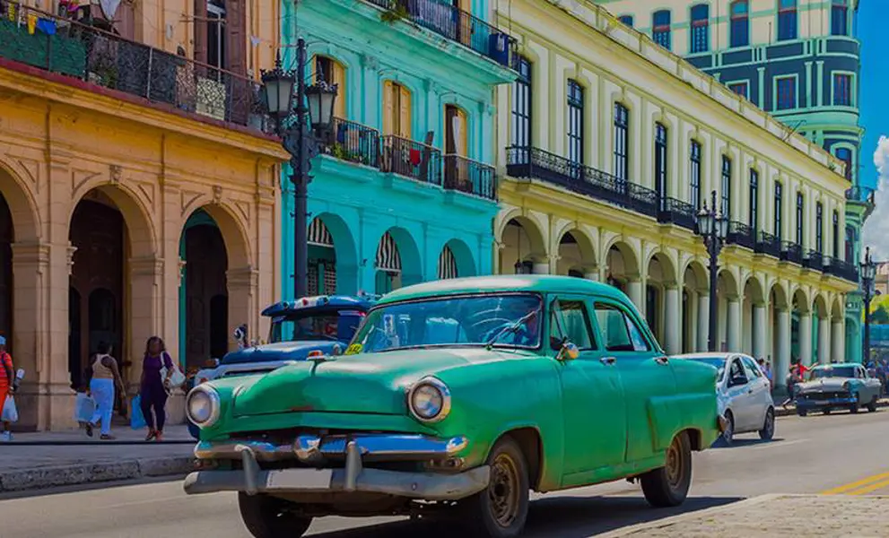 Classic Green American car in Cuban street, Cuba