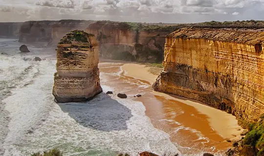 Waves crashing against the shore and cliffs